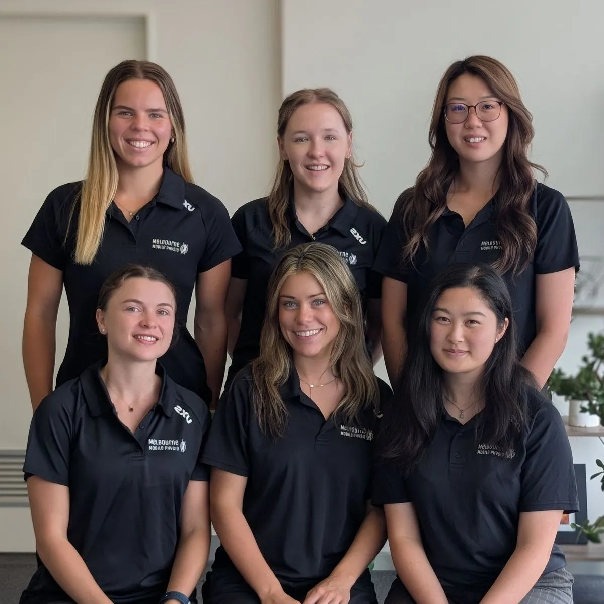 Six of Melbourne Mobile Physio's occupational therapists in team uniform